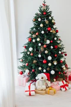 Christmas tree pine white interior room new year decor garland gifts postcard Фото