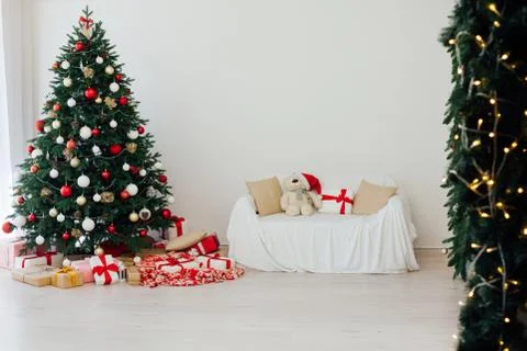 Christmas tree pine white interior room new year decor garland gifts postcard Фото