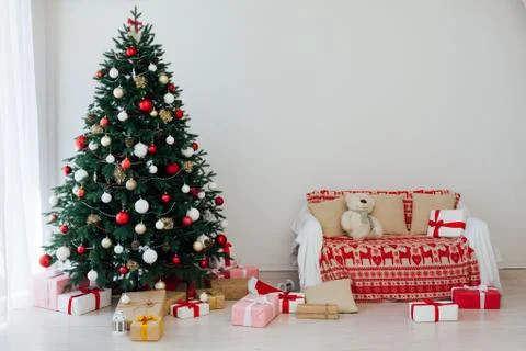 Christmas tree pine white interior room new year decor garland gifts postcard 스톡 사진