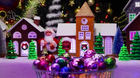 Christmas tree points spinning against of a Christmas town with Santa Claus Stock Footage 292877357