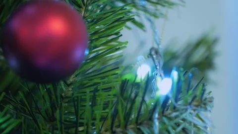 A Christmas tree with a red and white ornament hanging from it Video stock 277270559