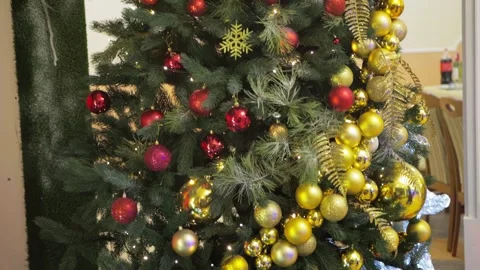 Christmas tree with red and yellow balls and gifts under the tree. Waiting for Video stock 252876059