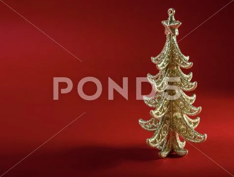 Christmas tree on red background Stock Photos