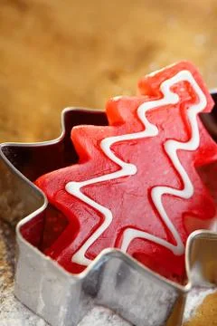 Christmas tree red candy in cookie cutter, wooden background Stock Photos