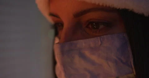 Christmas Tree Reflected in Woman's Eye Wearing Mask During Covid Vidéo 144644564