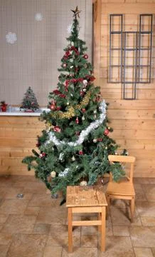 Christmas tree in rustic interior Stock Photos