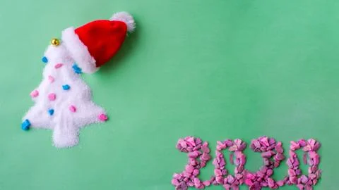 Christmas tree Santa hat. Santa's Claus at home at night making magic Stock Photos