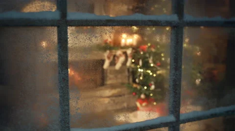 Christmas tree scene through frozen window frame Stock Footage
