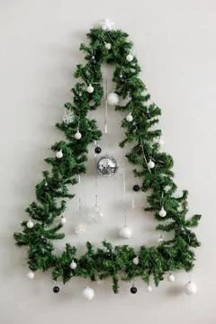Christmas tree in the shape of a triangle decorated with black and white ba.. Stock Photos