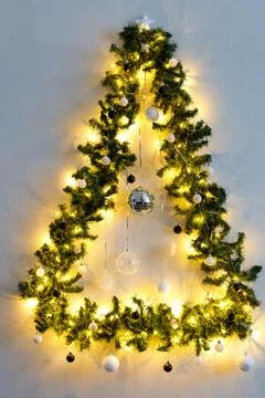 Christmas tree in the shape of a triangle decorated with black and white ba.. Stock Photos