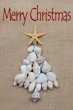 Christmas Tree of Shells on Burlap Fotos de archivo
