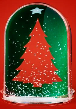 Christmas tree in snow globe Stock Photos