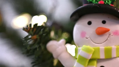 Christmas tree, snowman looking at it from left to right Stock Footage 227714040