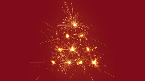 Christmas tree of sparklers, red background Stock Footage 200765650