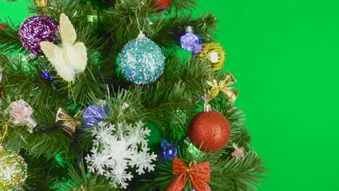 Christmas tree is spinning on a green background Stock Footage 147235531