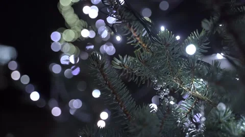 Christmas tree with spruce branches and white Christmas lights 스톡 동영상 322046834