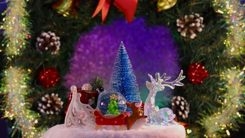 A Christmas tree surrounded by Santa Claus  a deer and glass ball Stock Footage 283526432