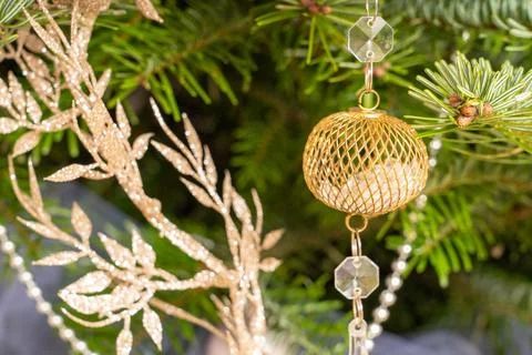 Christmas tree toy in the form of a ball hanging on the branches of the Chr.. Stock Photos
