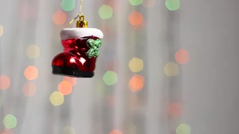 Christmas tree toy in the form of a red boot. Close-up. Video stock 143378886