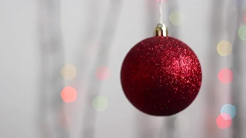 Christmas tree toy in the form of a sphere of red color with sparkles. Close-up. Stock Footage 143003598