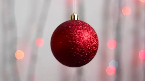 Christmas tree toy in the form of a sphere of red color with sparkles. Close-up. Stock Footage 143379169