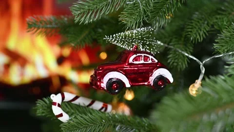 Christmas tree toy small red vintage car with a Christmas tree on the roof Stock Footage 221413006