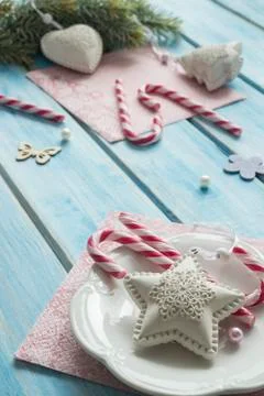 Christmas tree toys with Candy Cane on a beautiful blue wooden table. Stock Photos
