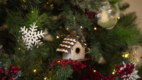 Christmas tree with toys close-up. The camera moves away from the toys on the Video stock 166633622