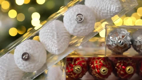 Christmas tree toys in transparent boxes stacking on shining bokeh background Stock Footage 286102659