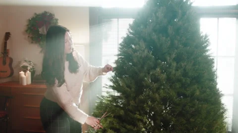 Christmas Tree Trimming And Set Up 6K 48FPS SLO-MO Stock Footage 144287331