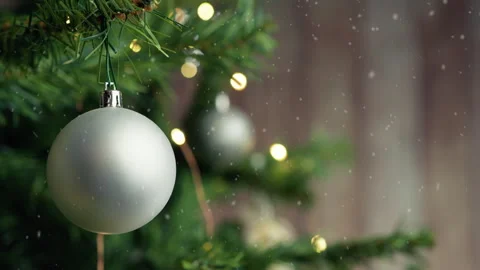 Christmas tree under the snow with silver ball as decoration Stock Footage 255026193