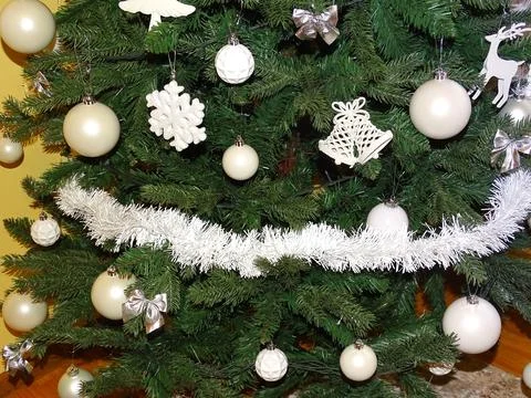 Christmas tree with white decorations Фото
