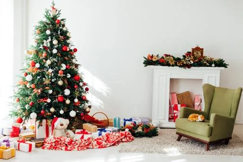 Christmas tree by the window with gift decor for the new year interior holiday Stock Photos