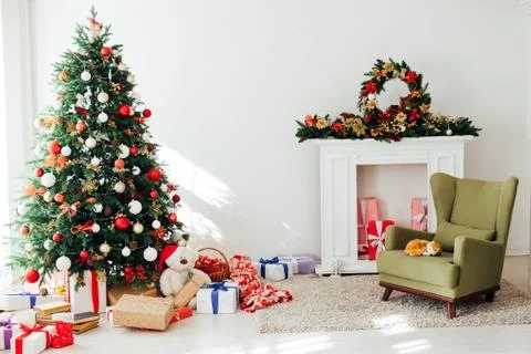 Christmas tree by the window with gift decor for the new year interior holiday Stock Photos