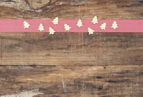 Christmas trees elements decoration on red ribbon boder and wooden background Stock Photos