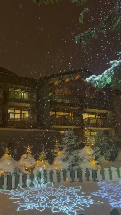 Christmas view with snow  by night in a ski resort in French alps. Stock Footage 337061678
