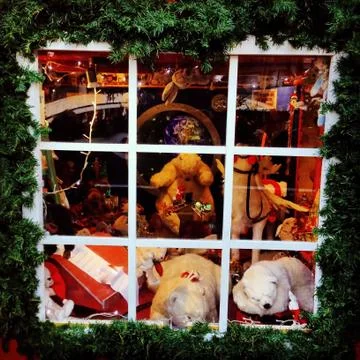 The christmas window behind the window decorated with fir branches for christmas Stock Photos