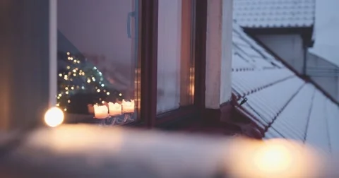 Christmas Window View, Burning Candles Twinkling Lights. 4K SLOW MOTION 120 fps 스톡 동영상 67220370