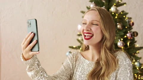 Christmas woman making congratulation video call chat on phone Stock Footage 166323023