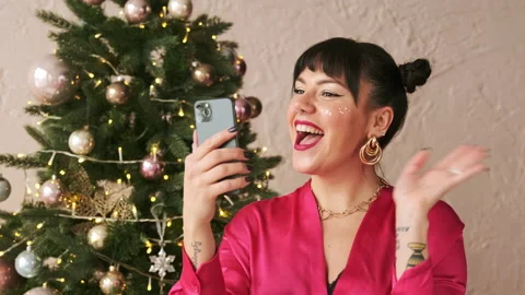 Christmas woman making congratulation video call chat on mobile phone Stock Footage 166323505
