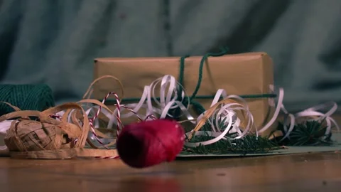 Christmas wrapping string falls to floor Stock-Footage 337408739