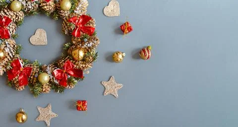 A Christmas wreath on a dark gray background. Top view with space for text. Stock Photos