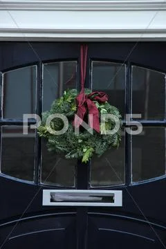 Christmas wreath on a door Stock Photos