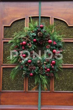 Christmas wreath on a glass door Stock Photos