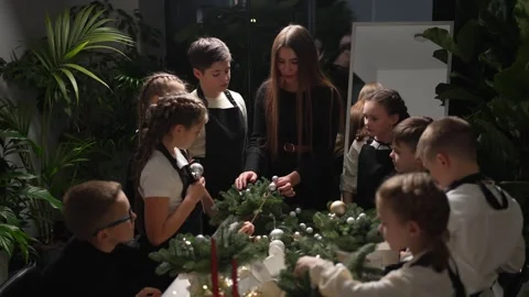 Christmas Wreath Making Class. A lesson for children on making Christmas wreaths Stock Footage 260423480