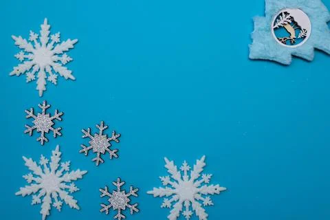 Christmass flatlay white snowflakes in shape frame and christmas tree Stock Photos