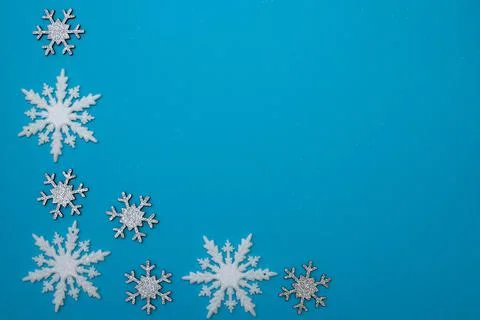Christmass flatlay white snowflakes in shape frame Stock Photos