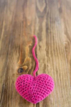 Chrocheted heart with a thread Stock Photos