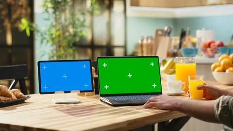 Chroma key and blue screen on laptop and tablet at the wooden table Stock Photos