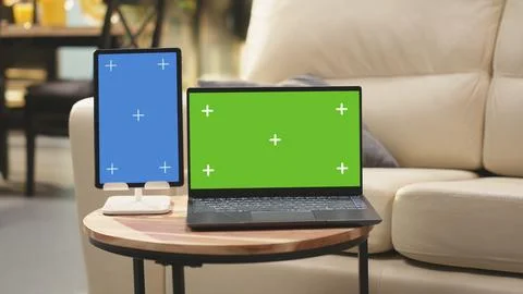 Chroma key and vertical blue screen in living room with coffee table Stock Photos